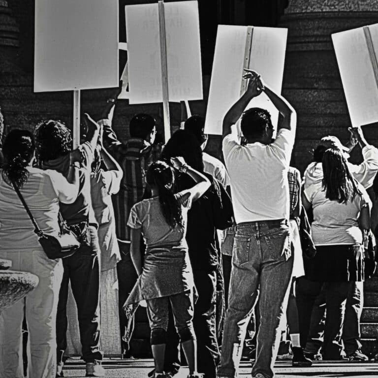 Faith community and financing page picture of a protest