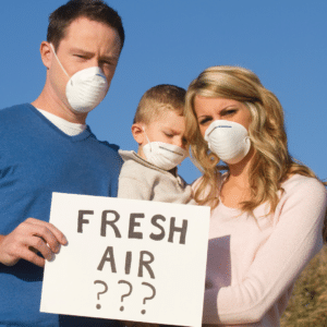 Oil gas sector emissions picture of family dealing with air pollution and a sign reading "fresh air?"